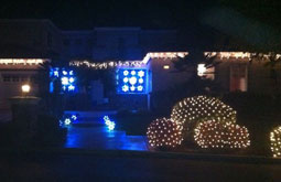 Residential house with christmas lights on house and bushes San Jose Bay Area Themes